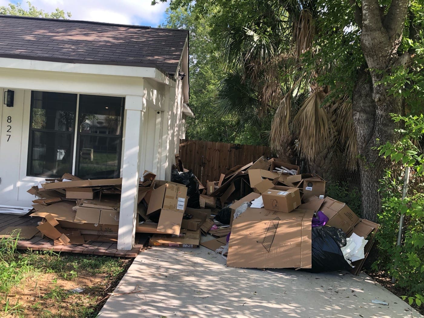 827 Denver Boulevard, San Antonio, with cardboard boxes stacked outside